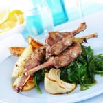 Grilled lamb cutlets on wilted garlic spinach.